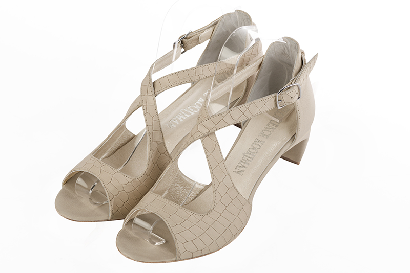 Champagne white women's closed back sandals, with crossed straps. Round toe. Low comma heels. Front view - Florence KOOIJMAN